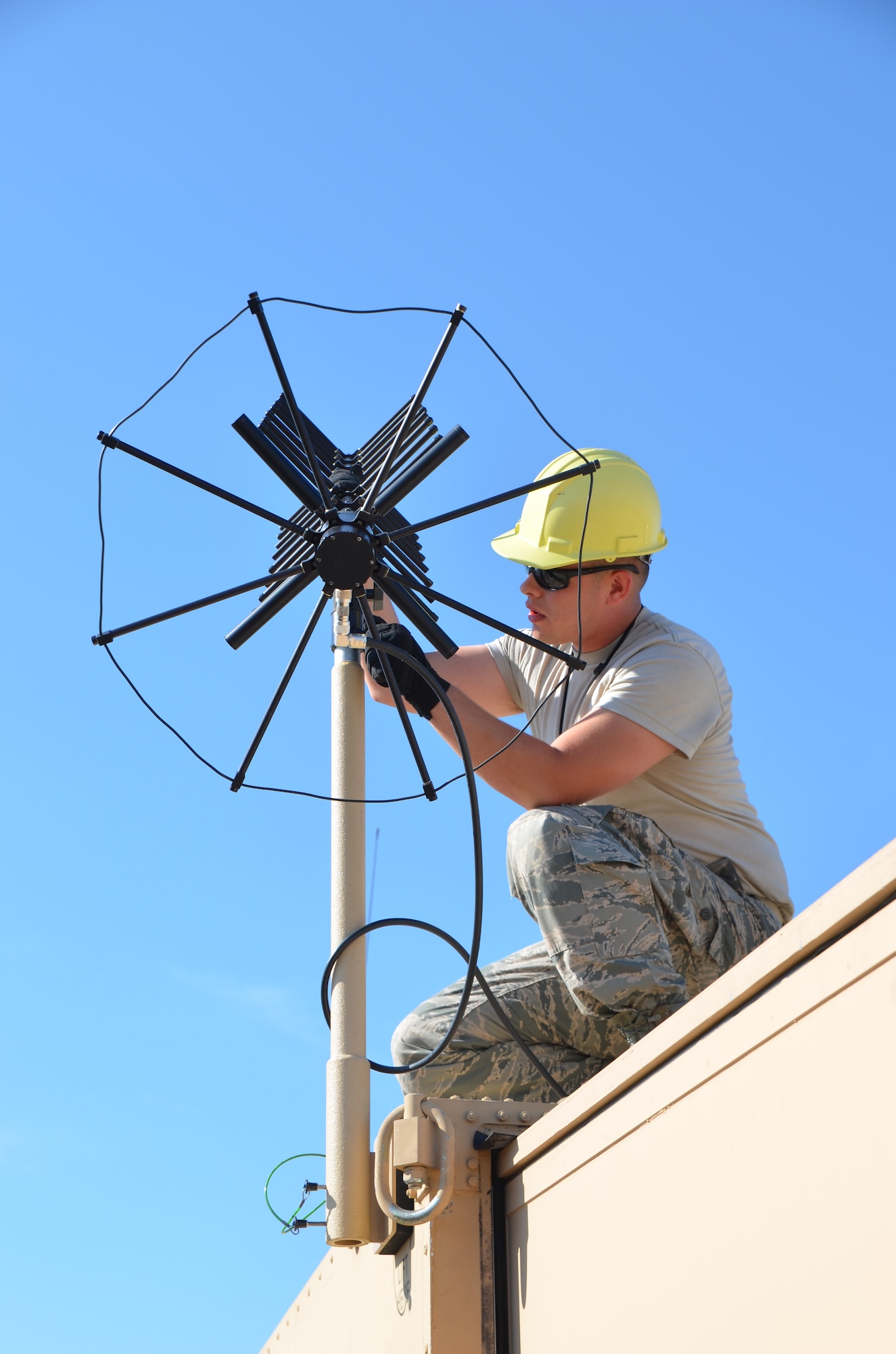SrA. Kyle Gauthier, 439th Airlift Control Flight communications, prepare an antenna atop the Hard-sided Expandable Lightweight Air Mobility Shelter in Pueblo, Colo., Aug. 24, during the annual AFRC-sponsored air mobility exercise, "Patriot Express." The ALCF is responsible for the training of Air Force and sister service units on how to move by air. They instruct over 400 units in preparing and loading their mobility equipment for air shipment. (U.S. Air Force photo/SrA. Kelly Galloway) 