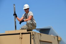 SrA. Kyle Gauthier, 439th Airlift Control Flight communications, begins to prepare to set up the Hard-sided Expandable Lightweight Air Mobility Shelter in Pueblo, Colorado, Aug. 22, 2013 just before the start of the annual AFRC-sponsored air mobility exercise, "Patriot Express." The ALCF is responsible for the training of Air Force and sister service units on how to move by air. They instruct over 400 units in preparing and loading their mobility equipment for air shipment. (U.S. Air Force photo/SrA. Kelly Galloway) 