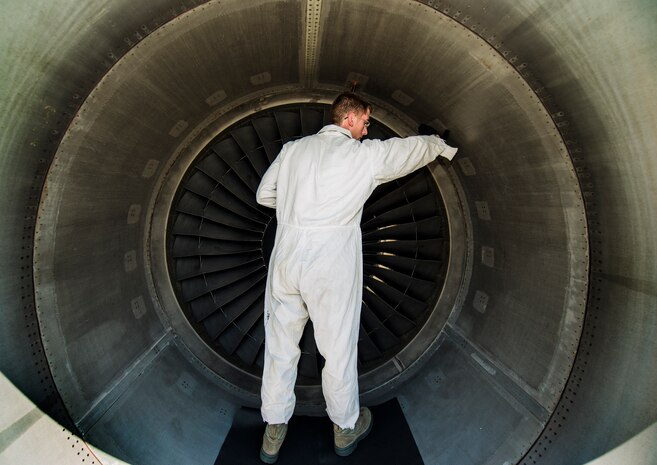 Senior Airman Cody Richman, 437th Aircraft Maintenance Squadron C-17 Globemaster III flying crew chief, inspects for cracks, bumps or other flaws during a routine maintenance check on a C-17 engine Aug. 12, 2013, at Joint Base Charleston – Air Base, S.C. Richman’s job as a crew chief is to ensure the aircraft is working properly and safe to fly at a moment’s notice. (U.S. Air Force photo/ Senior Airman Dennis Sloan)