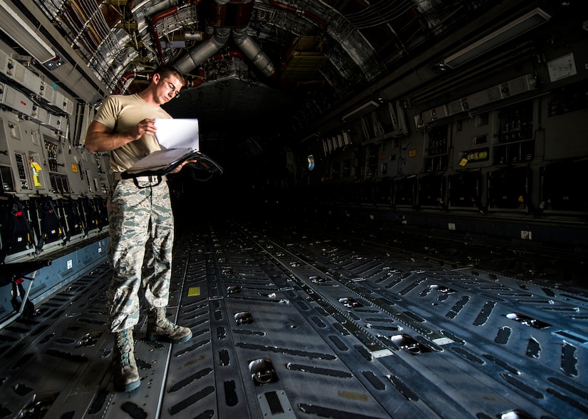 Senior Airman Cody Richman, 437th Aircraft Maintenance Squadron C-17 Globemaster III flying crew chief, performs an inspection on a C-17 Aug. 12, 2013, at Joint Base Charleston – Air Base, S.C. Richman ensures the aircraft is working properly and is safe to fly at a moment’s notice. (U.S. Air Force photo/ Senior Airman Dennis Sloan)