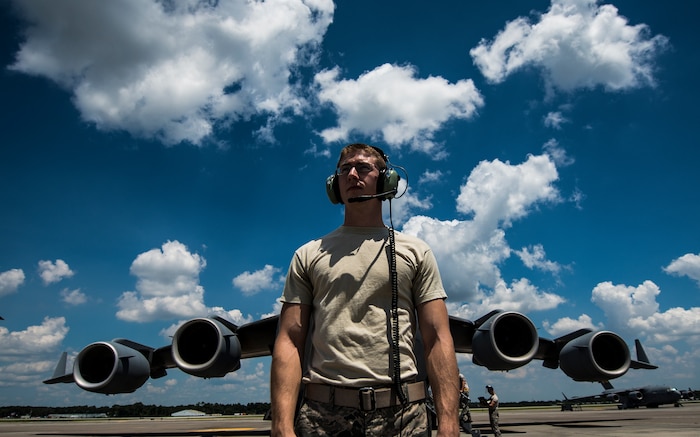 Senior Airman Cody Richman, 437th Aircraft Maintenance Squadron C-17 Globemaster III flying crew chief, stands in front of a C-17 Aug. 12, 2013, at Joint Base Charleston – Air Base, S.C. ensures the aircraft is working properly and is safe to fly at a moment’s notice. (U.S. Air Force photo/ Senior Airman Dennis Sloan)