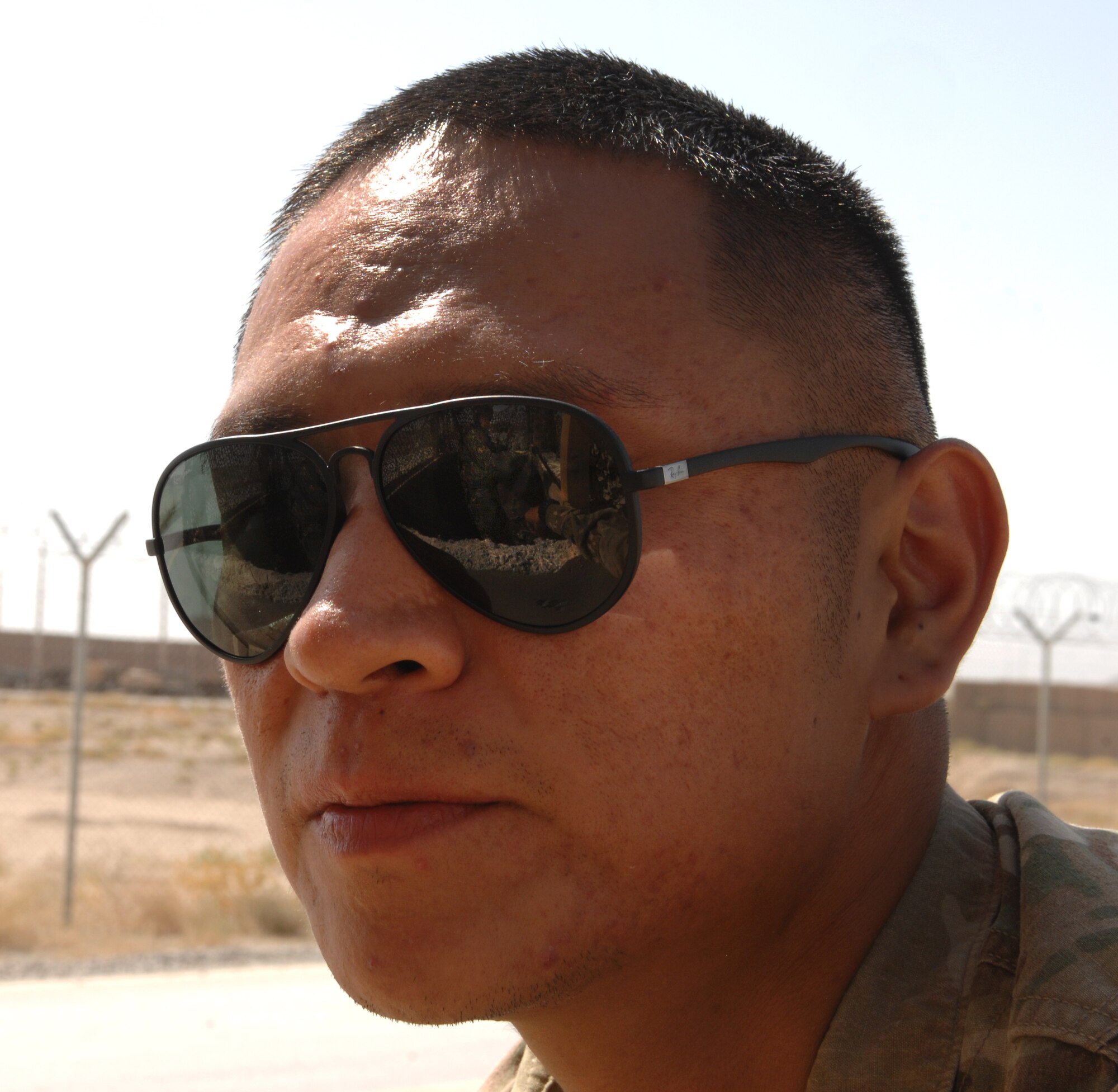 Staff Sgt. Brandon Etsitty, 451st Air Expeditionary Wing force protection, watches as 451st Expeditionary Maintenance Squadron Munitions Airmen perform during an exercise at Kandahar Airfield, Afghanistan, Aug. 22, 2013. Etsitty is responsible for ensuring Airmen are following the proper force protection procedures during exercises, since knowing the proper procedures could potentially save lives in real-world situations. Etsitty is deployed from Lackland Air Force Base, Texas.(U.S. Air Force photo by Senior Airman Jack Sanders)   