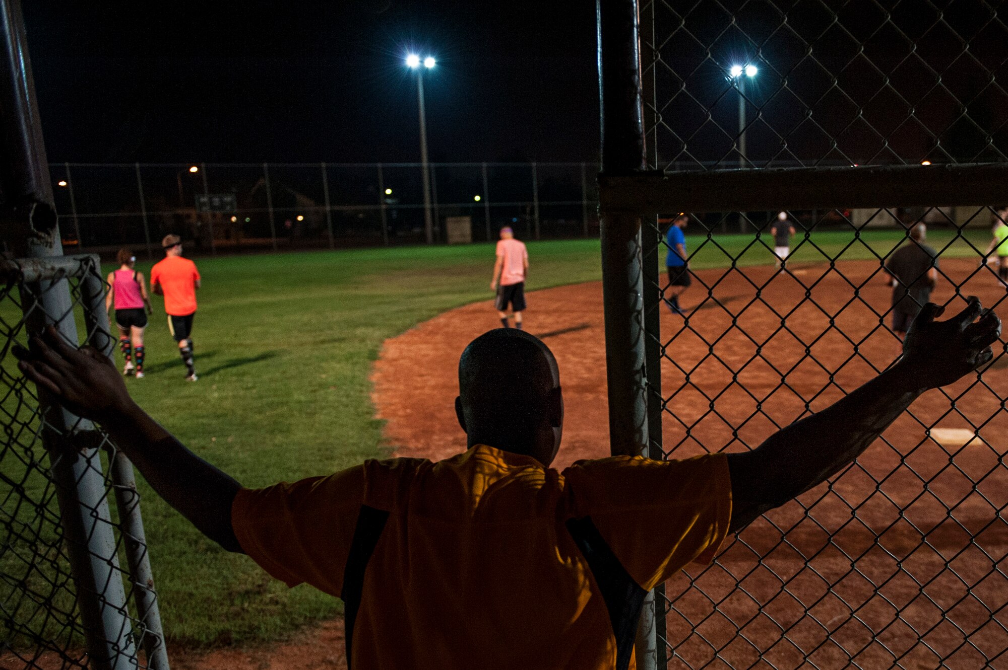 Roy Robins, 39th Force Support Squadron superintendent of fitness and sports, watches from the dugout at a kickball tournament Aug. 23, 2013, at Incirlik Air Base, Turkey.   Airmen and civilians from the 39th Logistics Readiness Squadron won against the 39th Air Base Wing Command Post, 39th Force Support Squadron and 39th ABW Wing Staff Agencies. (U.S. Air Force photo by Airman 1st Class Nicole Sikorski/Released)