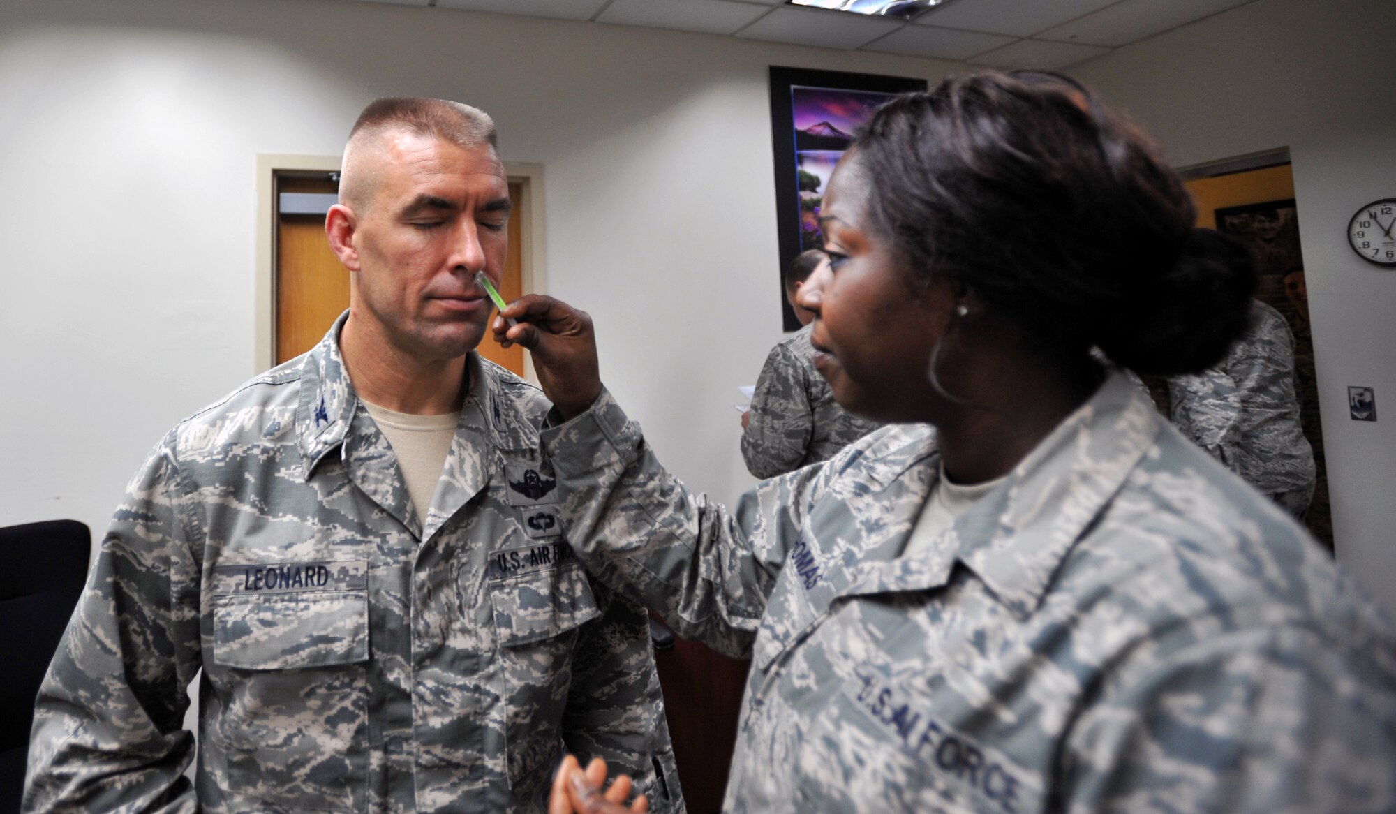 Col. Brook Leonard, 51st Fighter Wing commander, receives a flu mist at Osan Air Base, Republic of Korea, Aug. 27, 2013. Active duty military members are required to receive the flu vaccination every year. Members of the 51st Medical Group will be administering the flu mist, or flu shot if necessary at the Base Theater on Aug. 28 from 10:30 a.m. to 3 p.m., and Sept. 4, 5 and 12 from 11:30 a.m. to 3 p.m.  (U.S. Air Force photo/Senior Airman Siuta B. Ika)