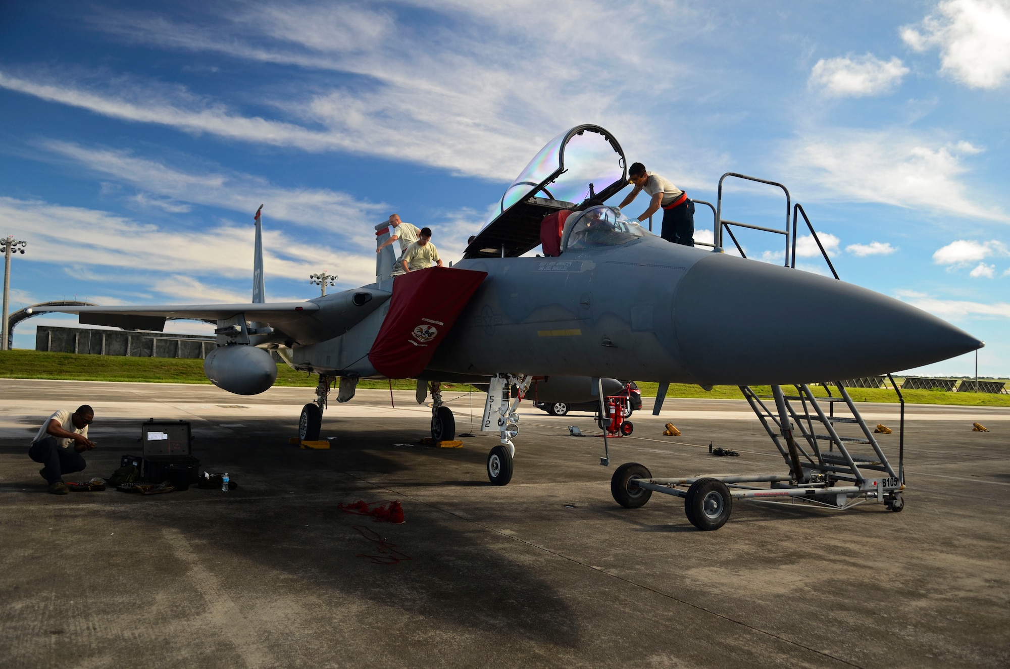 Airmen from the 18th Maintenance Group from Kadena Air Base, Japan, conduct pre-flight maintenance on an F-15 Eagle Aug. 27, 2013, on the Andersen Air Force Base, Guam, flightline. The F-15s were scheduled to return the same day back to Kadena Air Base, Japan, after completing the Aviation Relocations Program. (U.S. Air Force photo/Airman 1st Class Marianique Santos)