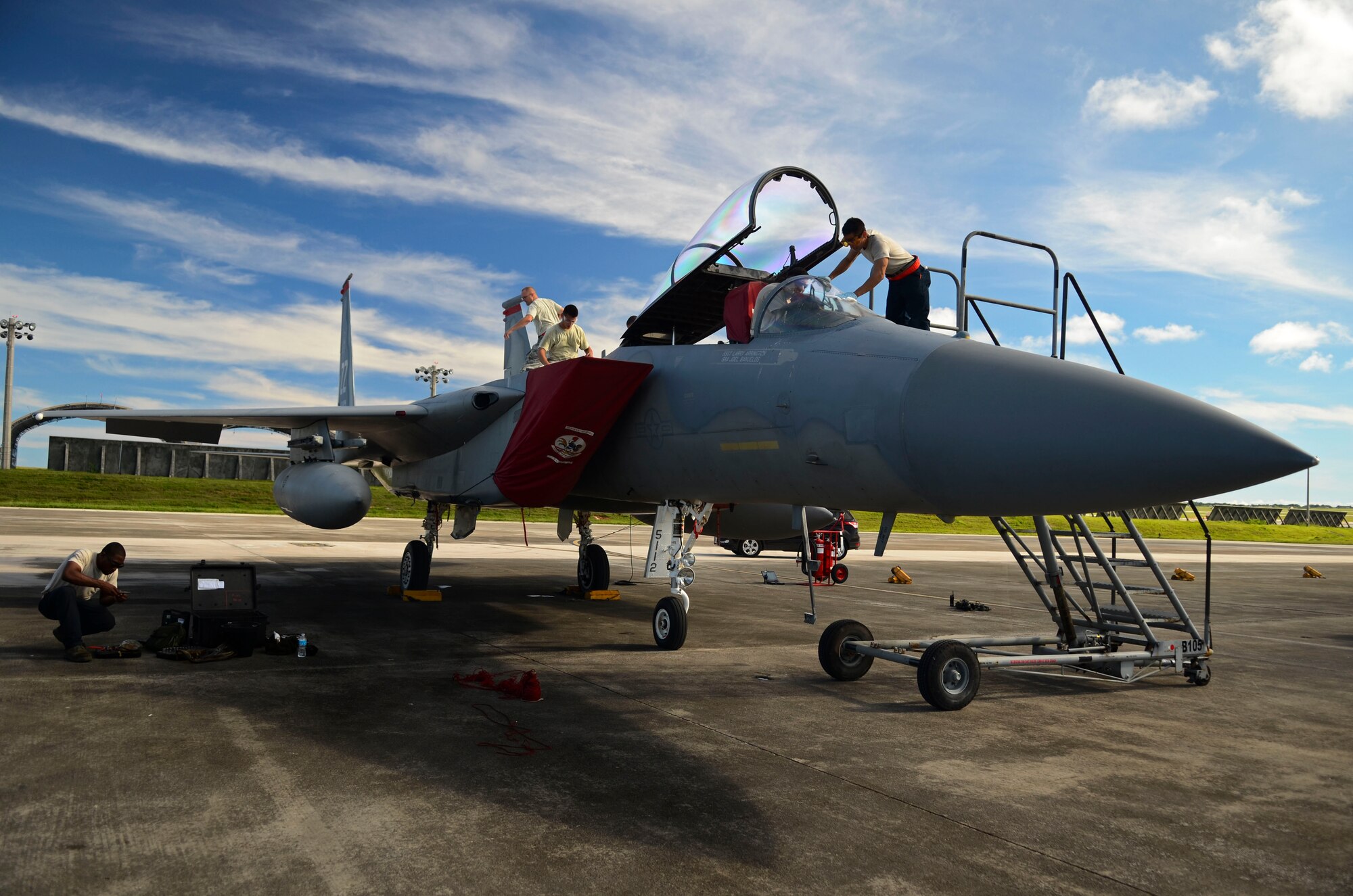 Airmen from the 18th Maintenance Group from Kadena Air Base, Japan, conduct pre-flight maintenance on an F-15 Eagle Aug. 27, 2013, on the Andersen Air Force Base, Guam, flightline. The F-15s were scheduled to return the same day back to Kadena Air Base, Japan, after completing the Aviation Relocations Program. (U.S. Air Force photo/Airman 1st Class Marianique Santos)