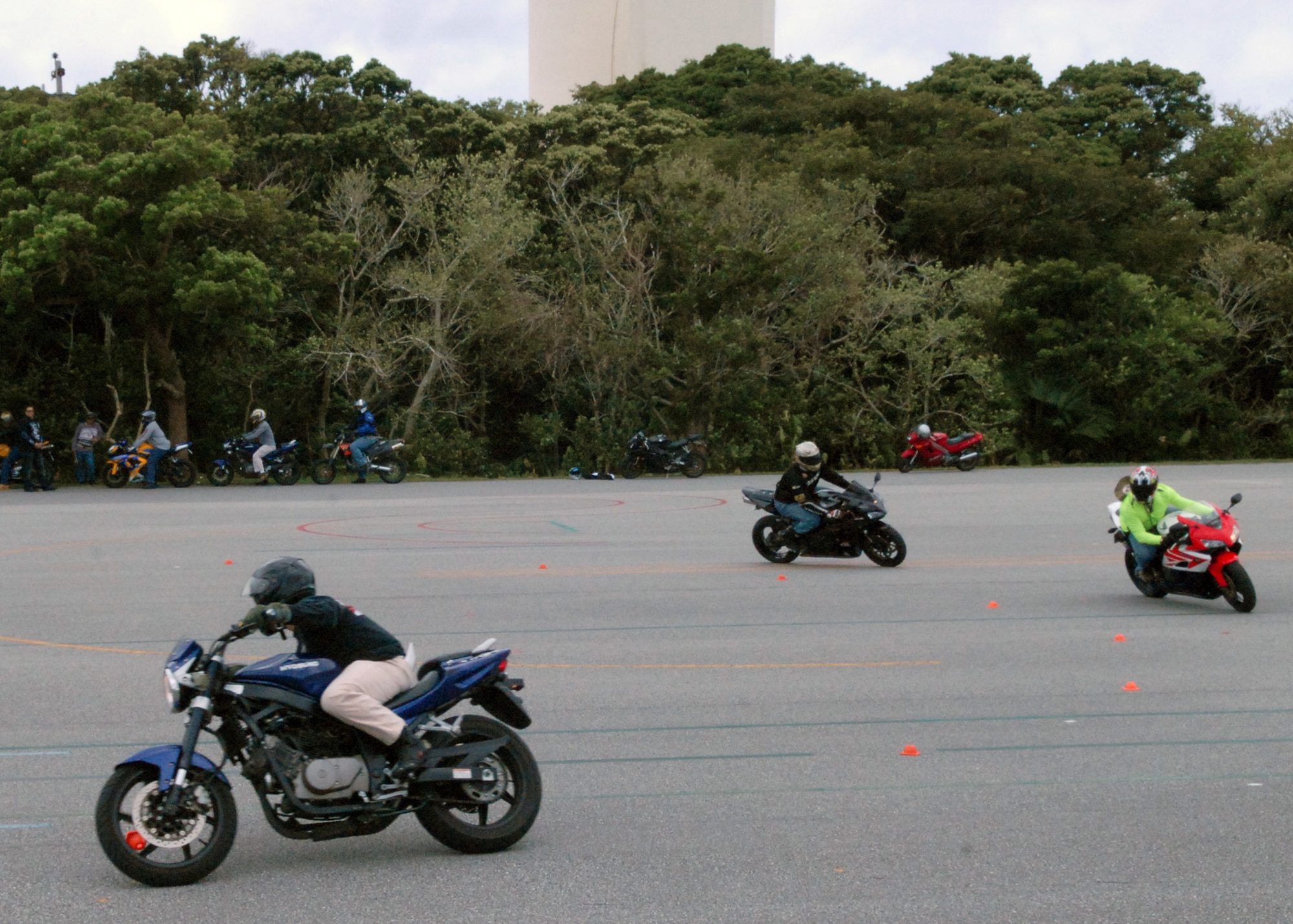 Motorcycle Safety Foundation coaches participate in a military sport bike rider course, on Kadena Air Base, Japan, Aug. 20, 2013. Training is available through the motorcycle training facility for riders of any experience level and can assist riders in building confidence in abilities and techniques to safely travel the streets of Okinawa. (U.S. Air Force photo by Staff Sgt. Lauren Snyder)