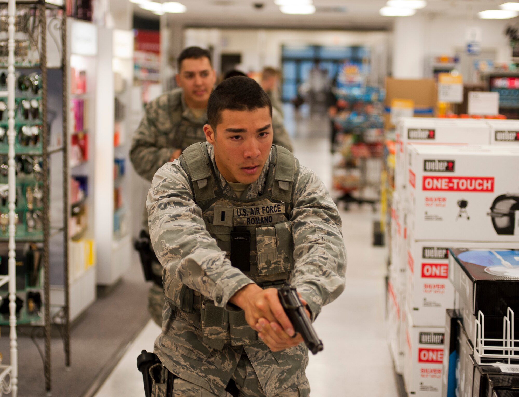 KUNSAN AIR BASE, Republic of Korea -- First Lt. Nicholas Romano, 8th Security Forces response team member, responds to a multiple "active shooters" call at the Base Exchange Aug. 23, 2013. Over the past two years Pacific Air Forces and partners Analytical Services Incorporated cadres have been training Airmen in tactics for the first responders. (U.S. Air Force photo by Senior Airman Armando A. Schwier-Morales/ Released)