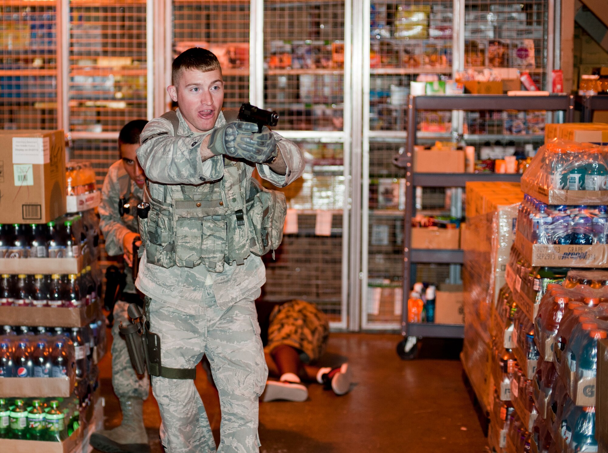 KUNSAN AIR BASE, Republic of Korea -- Airman 1st Class Spencer Rumley, 8th Security Forces Squadron response team member, yells at an "active shooter" during a training scenario Aug. 23, 2013. Asymmetric Threat, a division of Analytical Services Incorporated, trained Rumley and 20 other security forces Airmen in a course designed to prepare personnel for dangerous and unpredictable situations. (U.S. Air Force photo by Senior Airman Armando A. Schwier-Morales/ Released)