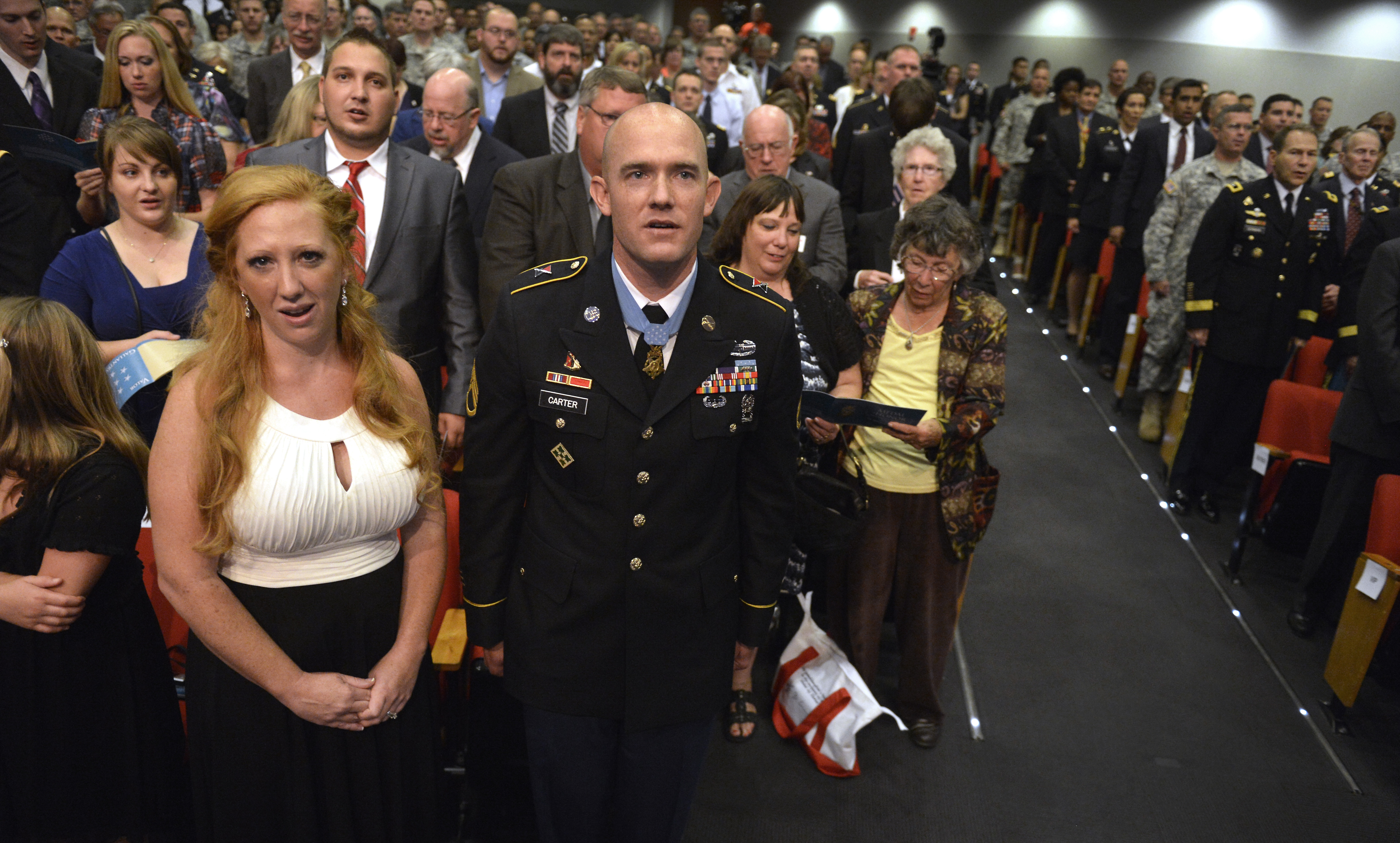 Medal of Honor recipient Army Staff Sgt. Ty Michael Carter and his wife,  Shannon, join the