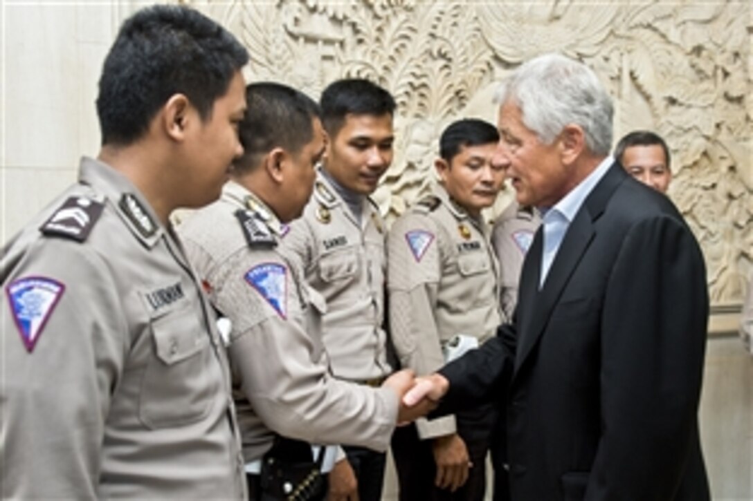 U.S. Defense Secretary Chuck Hagel thanks members of the Indonesian police force before departing Jakarta, Indonesia, Aug. 27, 2013. 