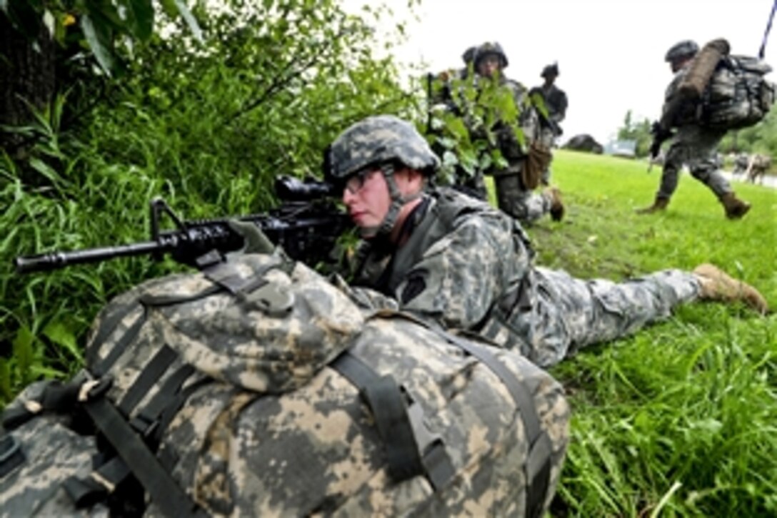 Army Pfc. JR Lanning provides security on the perimeter of the water treatment facility during training on Joint Base Elmendorf-Richardson, Alaska, Aug. 19, 2013. Lanning is assigned to the 1st Squadron Airborne, 40th Cavalry Regiment.