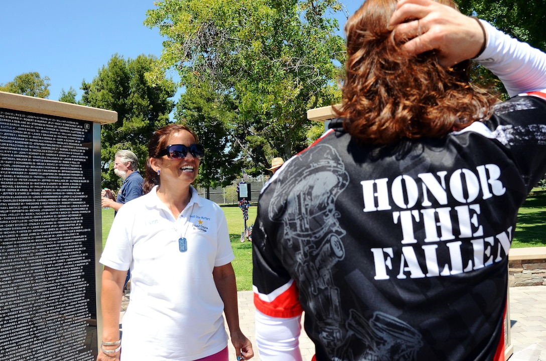 Jennifer Marino, a retired major, is cycling more than 2,700 miles, through 17 states, over the span of 77 days to meet with American Gold Star Mothers and their families in commemoration of service members killed in combat. One of Marino’s stops is the Northwood Gratitude and Honor Memorial in Irvine, Calif. where she gathered rubbings of the names of several service members. She plans to hand deliver the names to some of the families she will visit as she crosses the country.