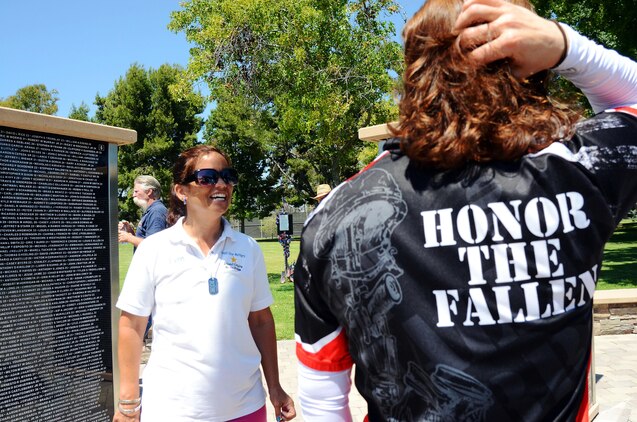 Jennifer Marino, a retired major, is cycling more than 2,700 miles, through 17 states, over the span of 77 days to meet with American Gold Star Mothers and their families in commemoration of service members killed in combat. One of Marino’s stops is the Northwood Gratitude and Honor Memorial in Irvine, Calif. where she gathered rubbings of the names of several service members. She plans to hand deliver the names to some of the families she will visit as she crosses the country.