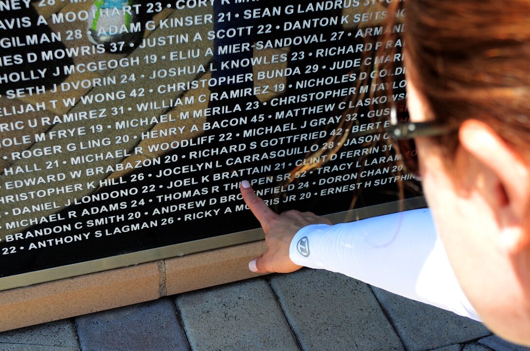 Jennifer Marino, a retired major, is cycling more than 2,700 miles, through 17 states, over the span of 77 days to meet with American Gold Star Mothers and their families in commemoration of service members killed in combat. One of Marino’s stops is the Northwood Gratitude and Honor Memorial in Irvine, Calif. where she gathered rubbings of the names of several service members. She plans to hand deliver the names to some of the families she will visit as she crosses the country.