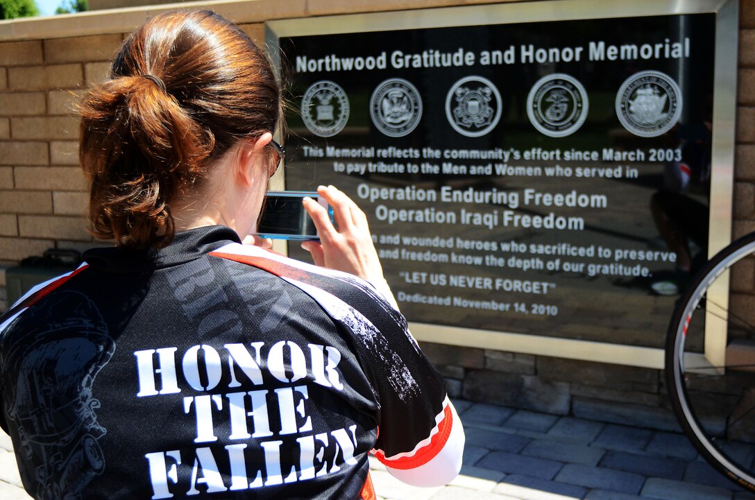 Jennifer Marino, a retired major, is cycling more than 2,700 miles, through 17 states, over the span of 77 days to meet with American Gold Star Mothers and their families in commemoration of service members killed in combat. One of Marino’s stops is the Northwood Gratitude and Honor Memorial in Irvine, Calif. where she gathered rubbings of the names of several service members. She plans to hand deliver the names to some of the families she will visit as she crosses the country.