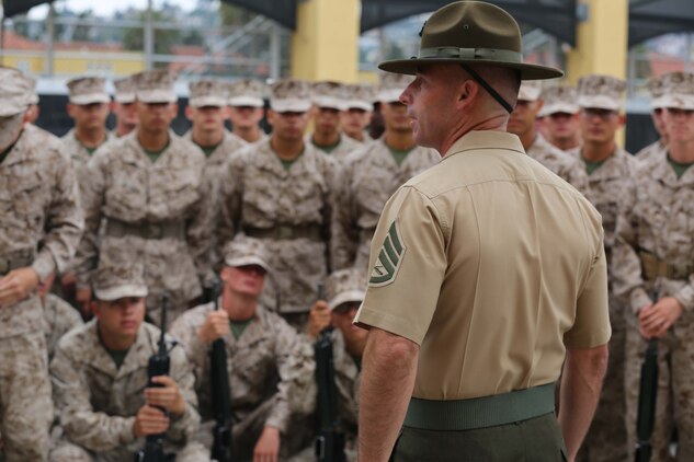 Recruits of Company D, 1st Recruit Training Battalion, receive words of encouragement from Staff Sgt. Billy J. Dodson, drill instructor, Platoon 1065, prior to conducting Final Drill aboard Marine Corps Recruit Depot San Diego, Calif., Aug. 7. Although Dodson did not lead the recruits during Final Drill, all drill instructors contributed to recruits learning drill. 