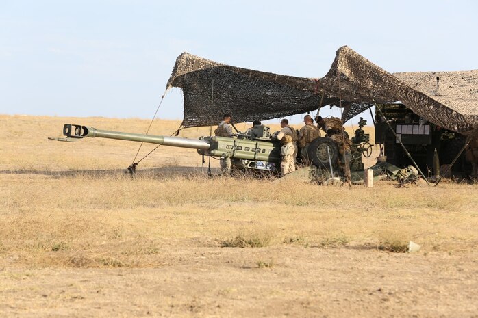 Marines serving with 1st Battalion, 11th Marine Regiment, perform maintenance on an M777 Lightweight Howitzer during a 10-day artillery training exercise here, Aug. 21, 2013. Marines with the entire regiment conducted the live-fire training exercise from Aug. 19 through 28.