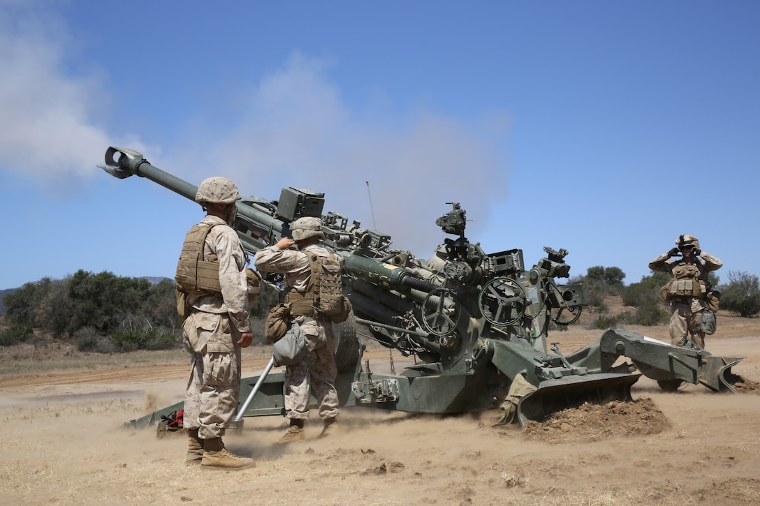 Marines serving with 1st Battalion, 11th Marine Regiment, fire an M777 Lightweight Howitzer during a 10-day artillery training exercise here, Aug. 23, 2013. Marines with the entire regiment conducted the live-fire training exercise from Aug. 19 through 28.