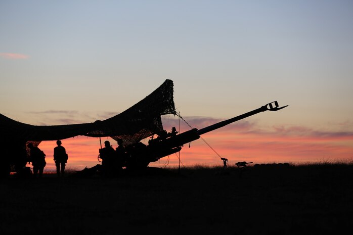 Marines serving with 1st Battalion, 11th Marine Regiment, prepare to fire an M777 Lightweight Howitzer during a 10-day artillery training exercise here, Aug. 21, 2013. Marines with the entire regiment conducted the live-fire training exercise from Aug. 19 through 28.