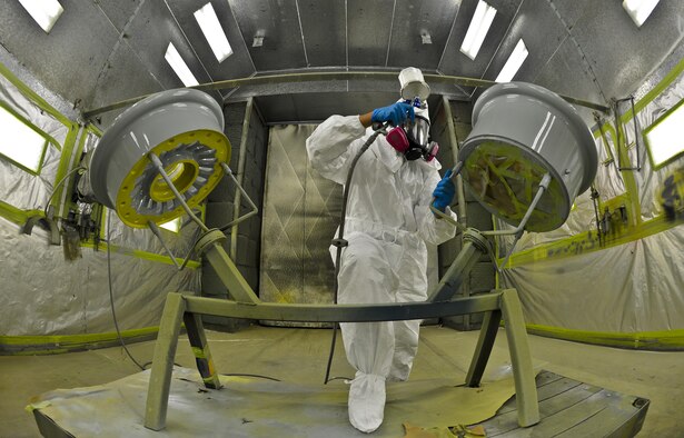 Airman 1st Class Eric Martinez, 6th Maintenance Squadron structures technician uses a newly designed wheel workstation to paint a KC-135 Stratotanker wheel, Aug 27, 2013 at MacDill Air Force Base, Fla. The implementation of the WWS reduced the paint process time by 26 hours per set.