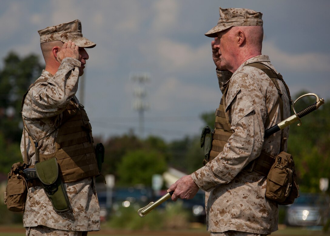 Sgt. Maj. Anthony A. Spadaro, the sergeant major of Marine Forces Reserve and Marine Forces North salutes Lt. Gen. Richard P. Mills, commander of MARFORRES and MARFORNORTH, before accepting the noncommissioned officer sword during the MARFORRES assumption of command and appointment ceremony aboard Marine Corps Support Facility New Orleans, Aug. 28, 2013. Mills is taking charge of the largest command in the Marine Corps, encompassing more than 100,000 Marines at more than 160 sites in 47 U.S. states, Guam and Puerto Rico. 