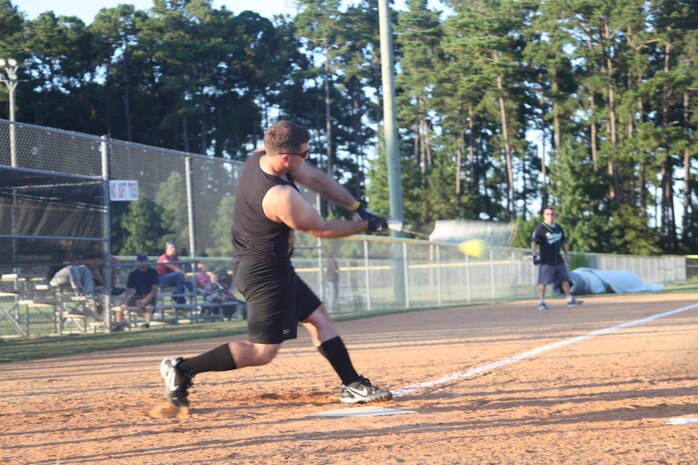 Joseph T. Pepitone with the Avionics Reapers swings away Monday during opening day of the 2013 fall softball league season here. Avionics Reapers cut down the Scorpions with an 11-6 win. 