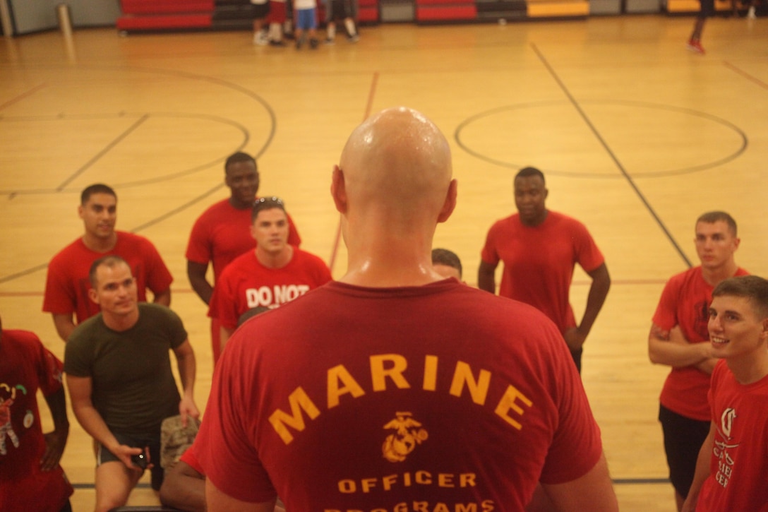 Capt. Craig D. Grindle, commanding officer of Company B, gives his Marines pointers and congratulates them for participating in the monthly Headquarters and Support Battalion Commander’s Challenge at the Area 1 gym aboard Marine Corps Base Camp Lejeune, Aug. 22. 