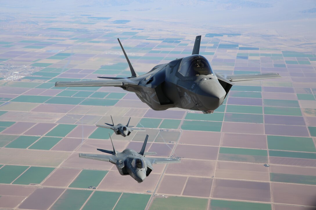 Three F-35B Lightning II Joint Strike Fighters with Marine Fighter Attack Squadron 121, 3rd Marine Aircraft Wing, fly in formation during  fixed-wing aerial refueling training over eastern California, Aug. 27. VMFA-121 is the first F-35B squadron in the Marine Corps. (Photo by Lance Cpl. Michael Thorn)