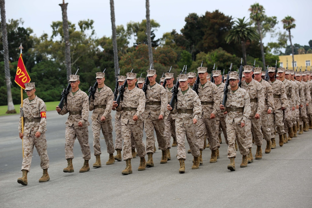 Recruit Andrew K. Roelle, Platoon 1070, Company D, 1st Recruit Training Battalion, leads his fellow platoon members during Final Drill aboard Marine Corps Recruit Depot San Diego, Aug. 7. Recruits were graded on various drill movements such as sling arms and by the left and right flank