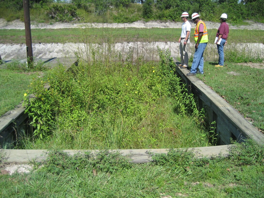 Hansler Bealyer (right), chief of the Real Estate Acquisition Branch, accompanies engineers Tony Smith (center) and Tim Gysan (left) on a River Acres site visit, to ensure real estate interests are appropriately addressed. 