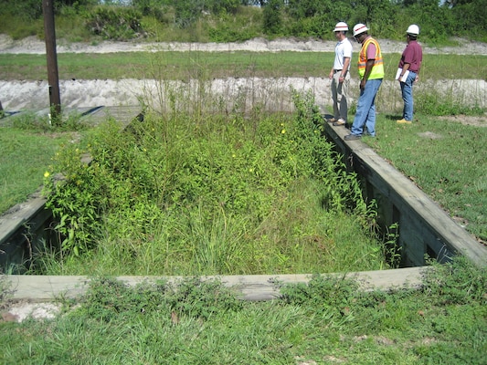 Hansler Bealyer (right), chief of the Real Estate Acquisition Branch, accompanies engineers Tony Smith (center) and Tim Gysan (left) on a River Acres site visit, to ensure real estate interests are appropriately addressed. 