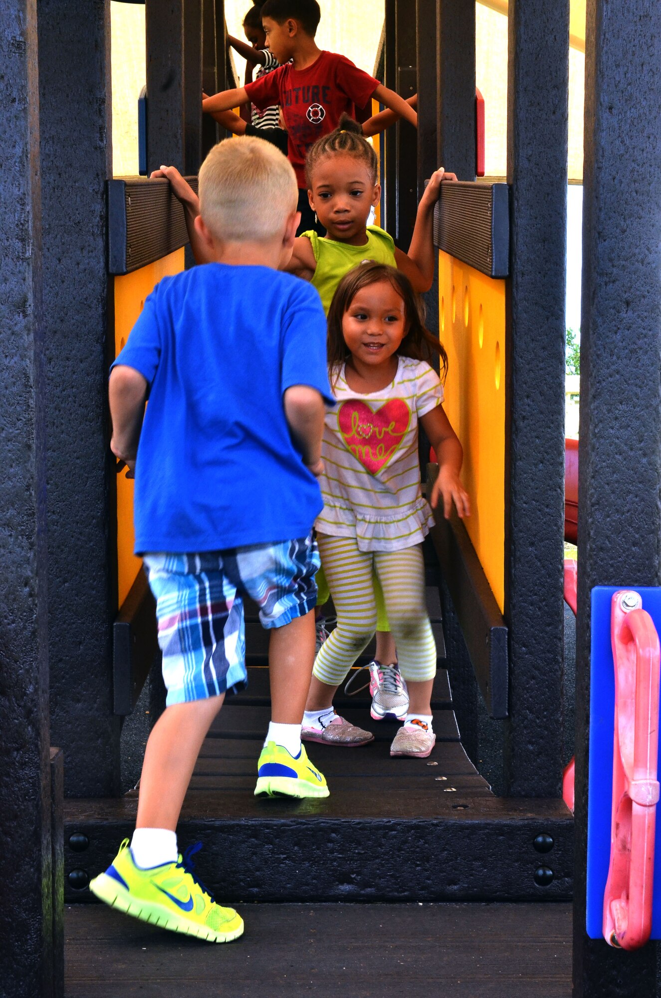 Children from the Child Development Center on Andersen Air Force Base, Guam, play at the center’s playground here during the after-school care program Aug. 28, 2013. The Andersen CDC offers after-school programs that are designed to improve social skills and provide creative outlets for children ages five to 12 years old. (U.S. Air Force photo by Airman 1st Class Mariah Haddenham/Released)