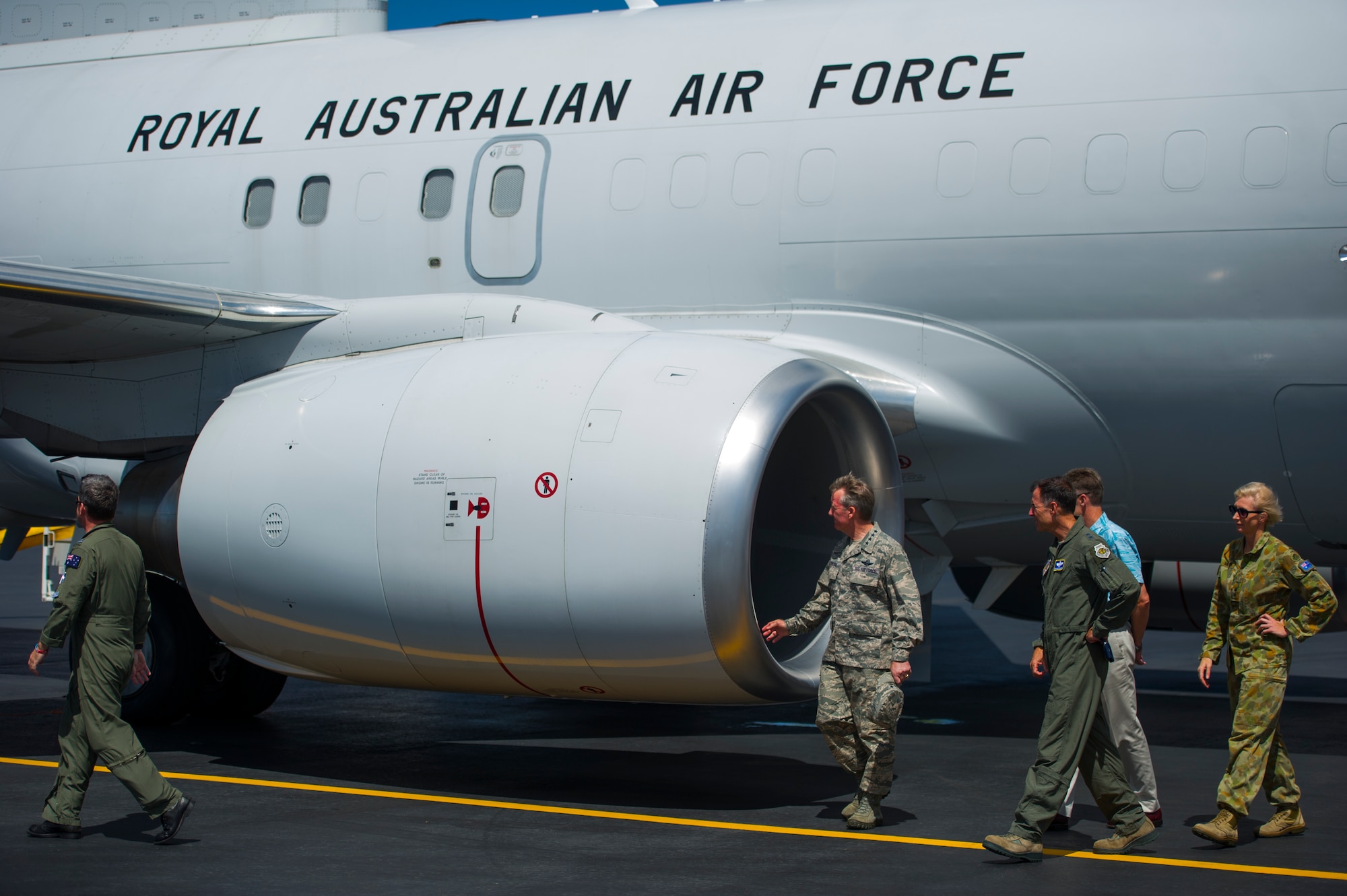 (From center to right) General Hawk Carlisle, Pacific Air Forces commander; Maj. Gen. Kevin Pottinger, PACAF Chief of Operations; and Mr. Scott Dewar, Australian Consul-General in Honolulu, Hawaii, tour the exterior of a Royal Australian Air Force E-7A Wedgetail Airborne Early Warning & Control aircraft on the flightline at Joint Base Pearl Harbor-Hickam, Hawaii, August 26, 2013.  The RAAF aircraft and crew were at JBPH-H on a stopover on the return home from participating in Red Flag-Alaska. RAAF Wedgetails have participated in three Red Flag exercises in the last two years; their interoperability with the U.S. Air Force and allied forces is vital to current and future combined operations in the Pacific theater. RAAF Wedgetail crew provided static displays and a familiarization flight to JBPH-H personnel, to familiarize Airmen with RAAF Wedgetail capabilities. (U.S. Air Force photo/Staff Sgt. Nathan Allen) 