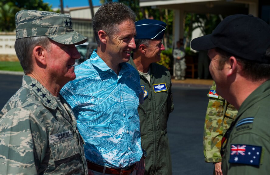 (From left) General Hawk Carlisle, Pacific Air Forces commander; Mr. Scott Dewar, Australian Consul-General in Honolulu, Hawaii; and Maj. Gen. Kevin Pottinger, PACAF Chief of Operations, greet the crew members of a Royal Australian Air Force E-7A Wedgetail aircraft on the flightline at Joint Base Pearl Harbor-Hickam, Hawaii, August 26, 2013.  The RAAF Wedgetail was at JBPH-H on a stopover on the return home from participating in Red Flag-Alaska. The Wedgetail’s interoperability with the U.S. Air Force and allied forces is vital to both current and future combined operations, particularly in the Pacific Command and PACAF areas of responsibility.  During the visit, Carlisle emphasized the long-standing history of cooperation between Australia and the United States, with an alliance solidly grounded on shared values and common security concerns and approaches.  Wedgetail participation in Red Flag-Alaska exercises directly assists the U.S. Air Force across all three of PACAF's core tenets: expanding engagement, increasing combat capability, and improving warfighter integration. (U.S. Air Force photo/Staff Sgt. Nathan Allen)