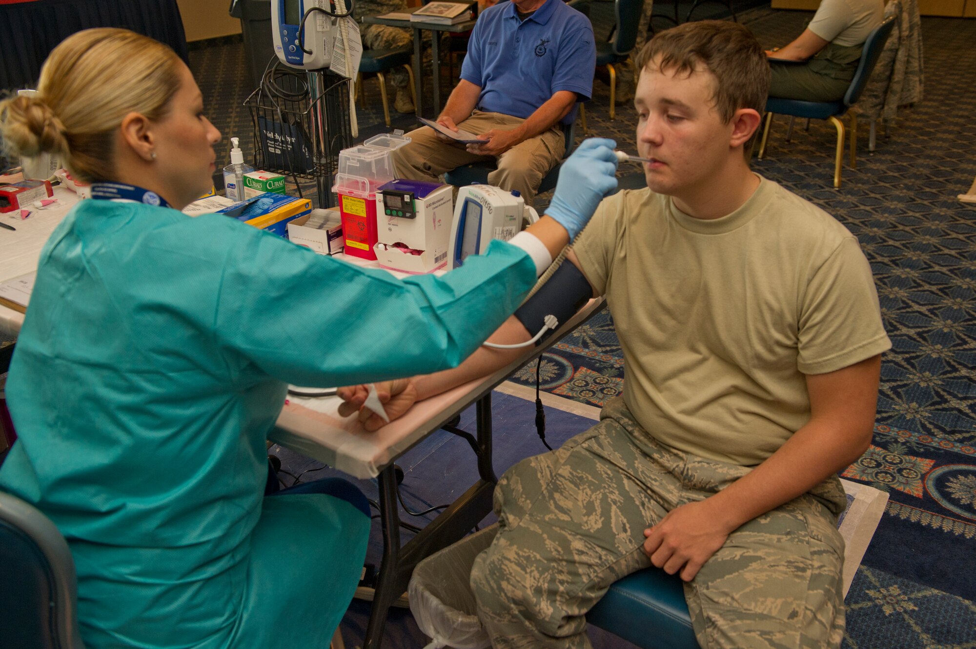 Airman 1st Class Seth Hall, 49th Wing command post controller, has his vitals taken to determine if he is eligible to donate blood at the Armed Services Blood Program blood drive at Holloman Air Force Base, N.M., Aug. 27. Holloman donated 46 units of blood during the drive. One donation can save up to three lives. (U.S. Air Force photo by Airman 1st Class Chase Cannon/Released)