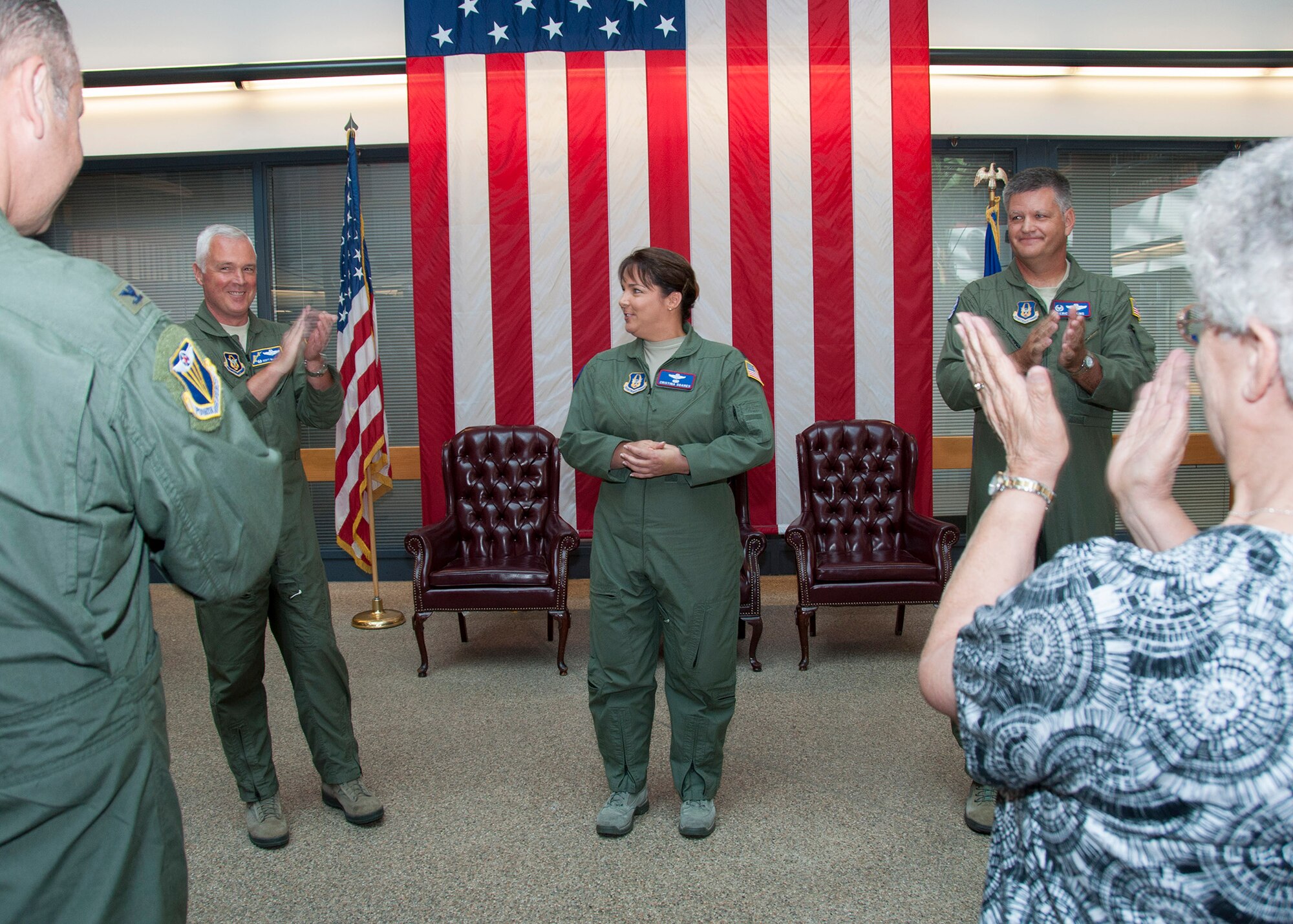 TRAVIS AIR FORCE BASE, Calif. -- Coworkers and family cheer Lt. Col. Cristina Soares, the new 79th Air Refueling Squadron commander, during a ceremony Aug. 24, 2013, at Travis Air Force Base, Calif. Soares assumed command of the squadron from Lt. Col. Eric Jenkins. (U.S. Air Force photo/Tech. Sgt. Rachel Martinez)