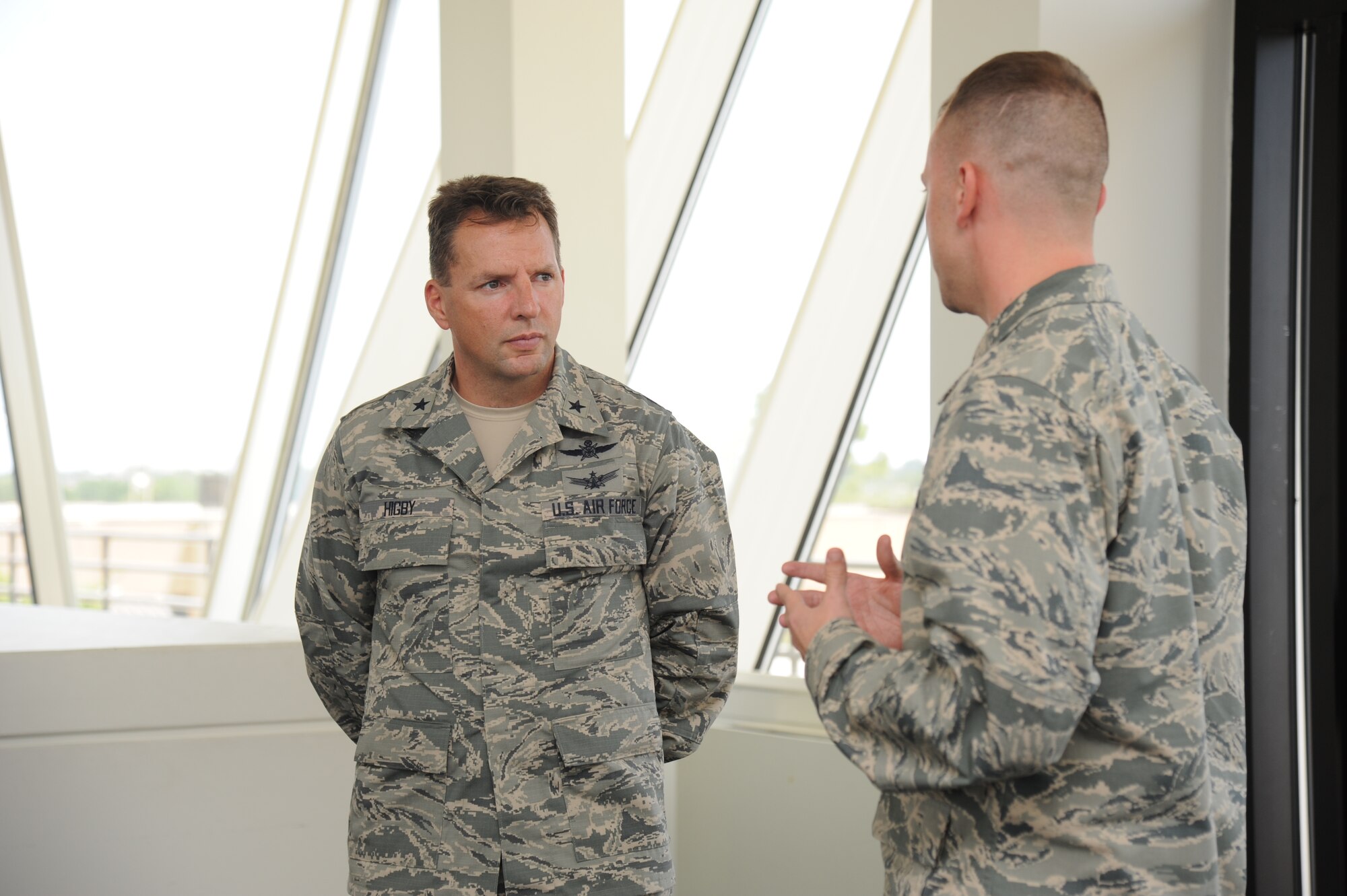Brig. Gen. Patrick Higby, 81st Training Wing commander, is briefed by 1st Lt. Brian Smith, 335th Training Squadron, in the weather training facility observatory room used for training during a two-day immersion tour of the 81st Training Group Aug. 26-27, 2013, at Keesler Air Force Base, Miss.  The purpose of the tour was to learn the integration of the group’s mission, operations and personnel.  Higby will continue his tour with the 81st Medical Group, 81st Mission Support Group and Wing Staff Agencies over the next couple of weeks.  (U.S. Air Force photo by Kemberly Groue)