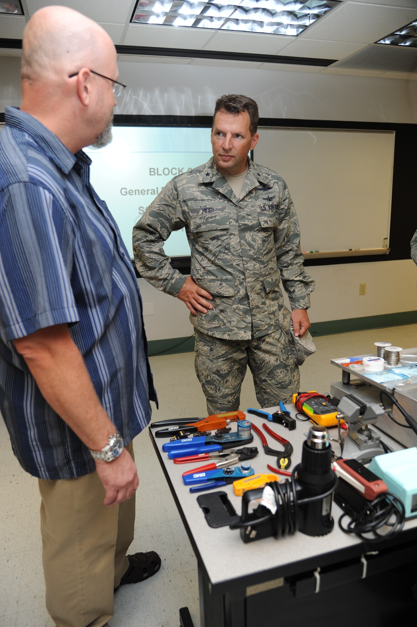 Joseph Spears, 335th Training Squadron, shows training equipment used in the avionics fundamentals course to Brig. Gen. Patrick Higby, 81st Training Wing commander, during a two-day immersion tour of the 81st Training Group Aug. 26-27, 2013, at Dolan Hall, Keesler Air Force Base, Miss.  The purpose of the tour was to learn the integration of the group’s mission, operations and personnel.  Higby will continue his tour with the 81st Medical Group, 81st Mission Support Group and Wing Staff Agencies over the next couple of weeks.  (U.S. Air Force photo by Kemberly Groue)
