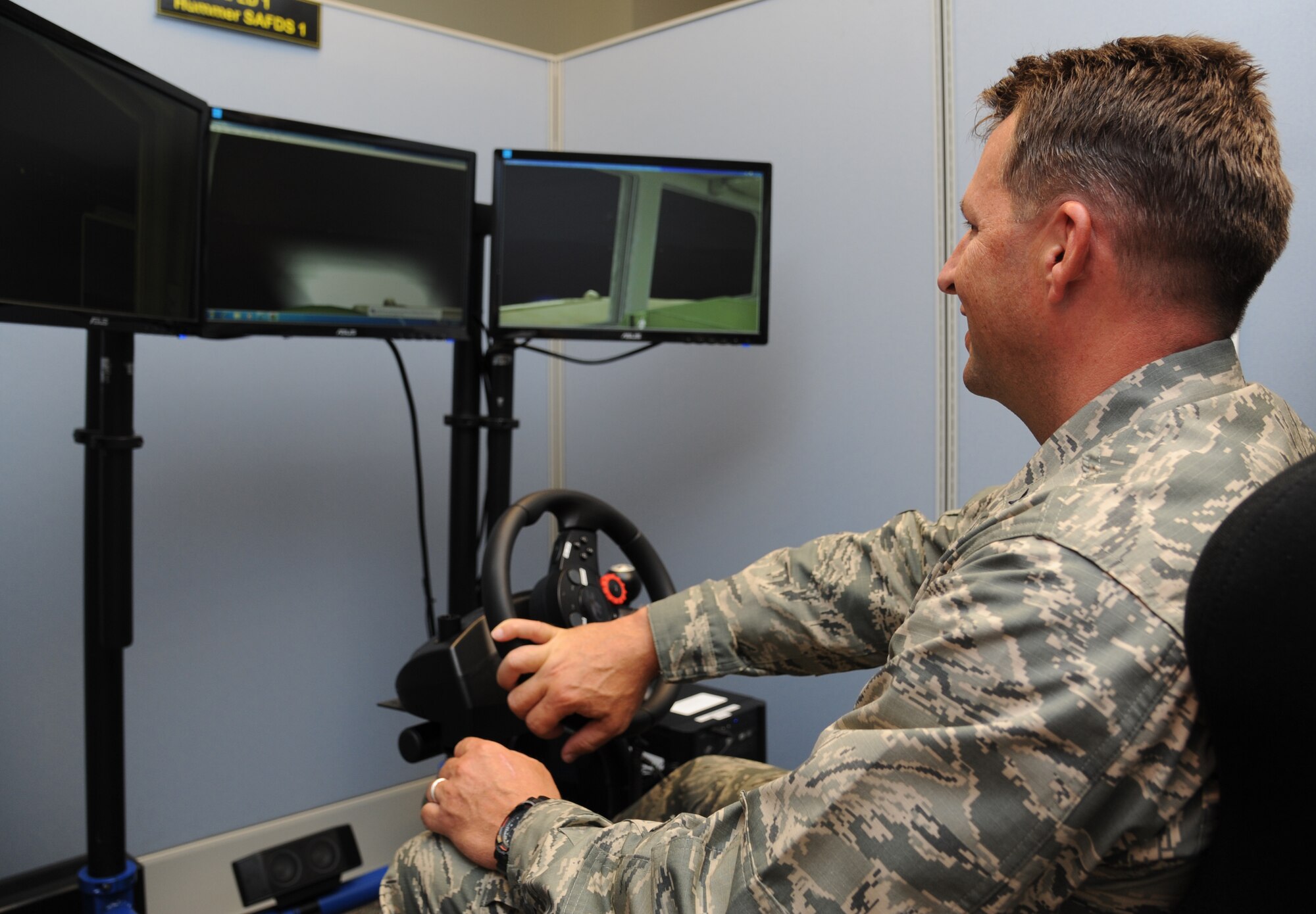 Brig. Gen. Patrick Higby, 81st Training Wing commander, tests out the 334th Training Squadron airfield driving simulator during a two-day immersion tour of the 81st Training Group Aug. 26-27, 2013, at Cody Hall, Keesler Air Force Base, Miss. The purpose of the tour was to learn the integration of the group’s mission, operations and personnel. Higby will continue his tour with the 81st Medical Group, 81st Mission Support Group and Wing Staff Agencies over the next couple of weeks.  (U.S. Air Force photo by Kemberly Groue)