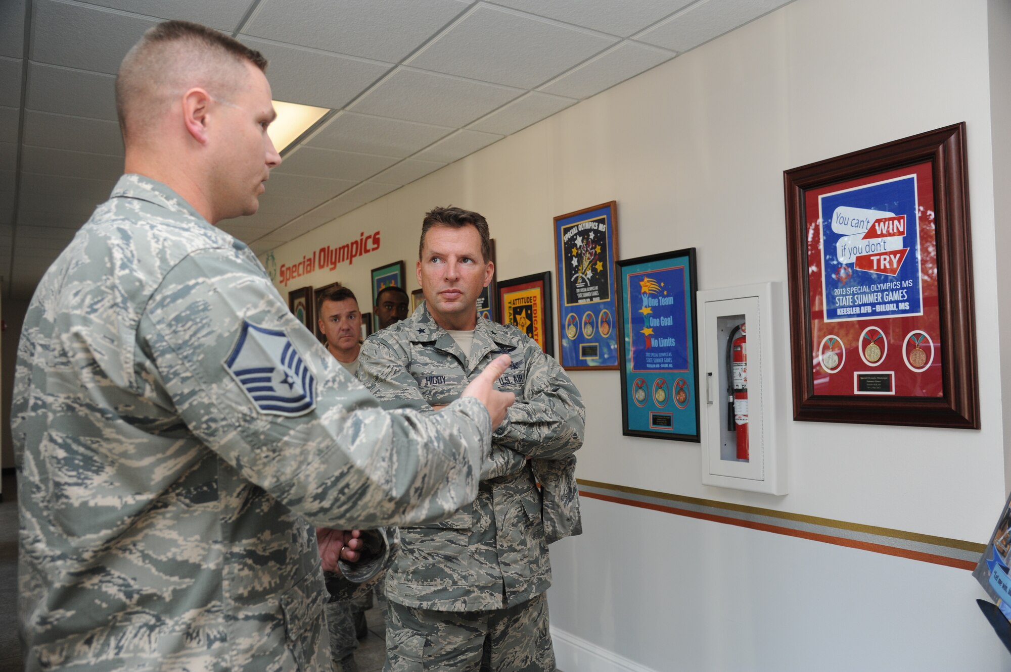 Master Sgt. Jedadiah Moss, Military Training Leader assistant flight chief, briefs Brig. Gen. Patrick Higby, 81st Training Wing commander, on the Airmen’s role for the Mississippi Special Olympics Summer Games hosted by Keesler during Higby’s two-day immersion tour of the 81st Training Group Aug. 26-27, 2013, at the Levitow Training Support Facility, Keesler Air Force Base, Miss.  The purpose of the tour was to learn the integration of the group’s mission, operations and personnel. Higby will continue his tour with the 81st Medical Group, 81st Mission Support Group and Wing Staff Agencies over the next couple of weeks.  (U.S. Air Force photo by Kemberly Groue)