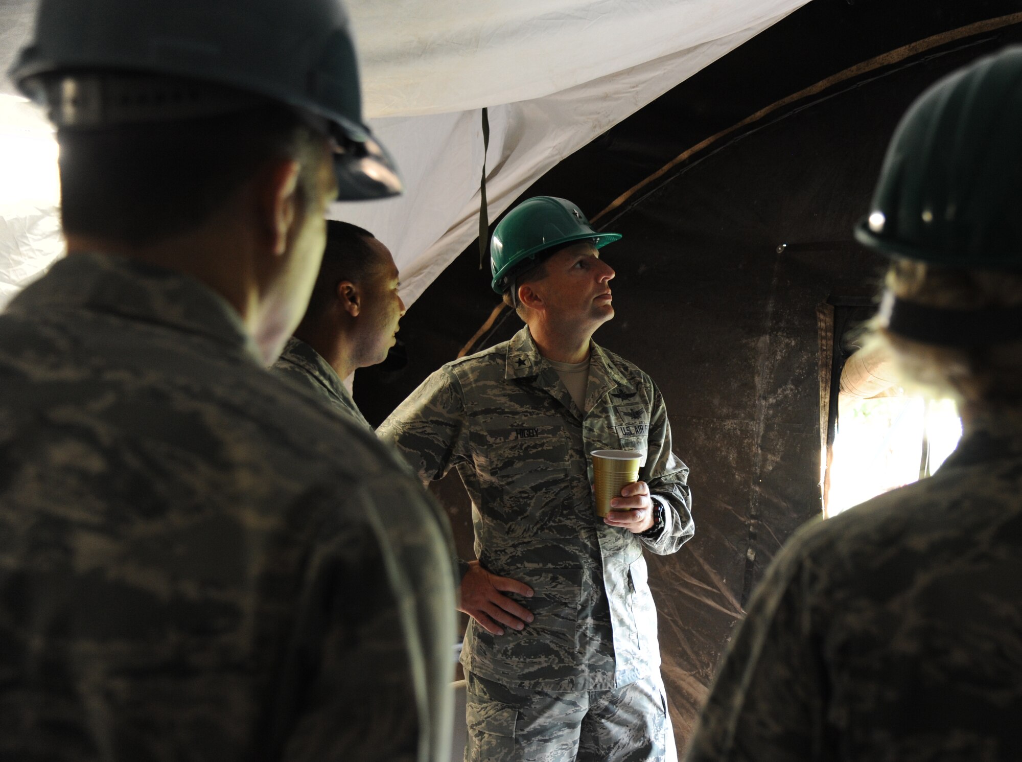 Master Sgt. Albrecco Jackson, 338th Training Squadron, shows Brig. Gen. Patrick Higby, 81st Training Wing commander, the inside of a training tent in the Air Expeditionary Forces training area of the Triangle during a two-day immersion tour of the 81st Training Group Aug. 26-27, 2013, at Keesler Air Force Base, Miss.  The purpose of the tour was to learn the integration of the group’s mission, operations and personnel.  Higby will continue his tour with the 81st Medical Group, 81st Mission Support Group and Wing Staff Agencies over the next couple of weeks.  (U.S. Air Force photo by Kemberly Groue)