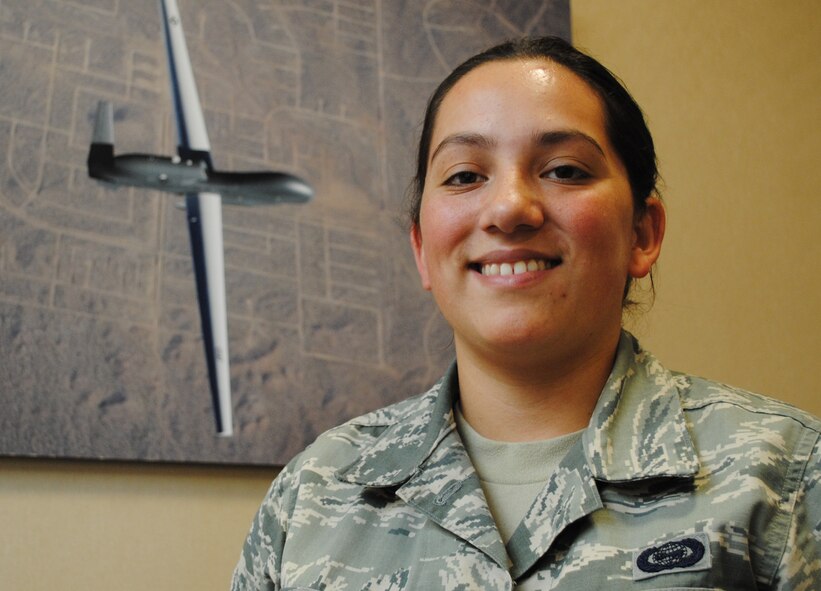 Airman 1st Class Alanna from the 348th Reconnaissance Squadron, poses for a photo in front inside Heritage Hall Aug. 9, 2013, on Grand Forks Air Force Base, N.D.  Senior Airman Alanna was recently named Grand Forks AFB’s Warrior of the Week, a selection that recognizes an individual’s hard work and professional. (U.S. Air Force photo/Staff Sgt. Luis Loza Gutierrez) 