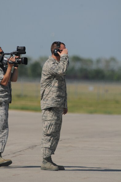 U.S. Air Force Tech. Sgt. Scott Hovda, a crew chief in the 119th Aircraft Maintenance Squadron, salutes as he assists pilots Col. Kent Olson, the 119th Wing commander and Col. Brad Derrig, the 119th Wing vice-commander, as they launch the last C-21 aircraft number 40064 at the North Dakota Air National Guard Base, Fargo, N.D., Aug. 27, 2013. The aircraft is making its’ final flight for the unit before being retired at the National Museum of the U.S. Air Force, Dayton, Ohio, Aug. 28, 2013. This particular aircraft was the first C-21 Lear Jet built for the U.S. Air Force. The aircraft is the last to depart the unit during a mission conversion, leaving the unit without a manned flying mission for the first time since it began in 1947. It will be the only state in the United States without a manned flying mission. The unit has an outstanding flying record with over 174,000 hours without a class A mishap in manned aircraft. The 119th Wing is one of only two Air National Guard units to be selected for the U.S. Air Force Hughes Trophy, awarded to flying units, and the only Air National Guard unit to win the award twice. The unit also won the William Tell World-Wide fighter competition three times while flying fighters. (U.S. Air National Guard photo by SMSgt. David H. Lipp/Released)