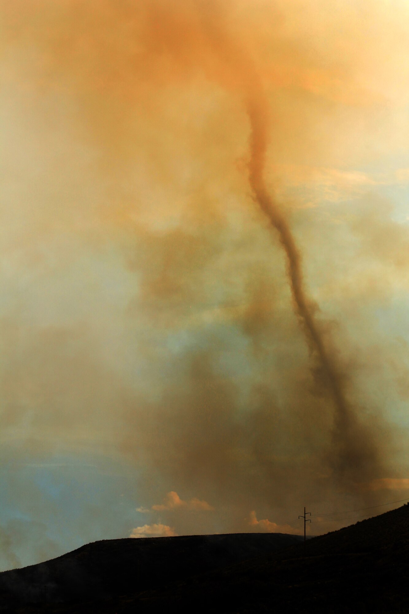 A cloud of smoke is produced by a fire Aug. 13, 2013 near Rockport Reservoir in Warship, Utah.  Fire season has begun in the western states, making it all the more important to apply fire prevention and safety practices.  (U.S. Air Force photo/Senior Airman Jette Carr)