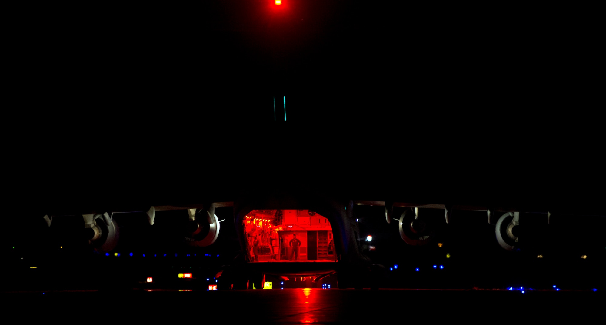 ALTUS AIR FORCE BASE, Okla. – A U.S. Air Force loadmaster from the 58th Airlift Squadron and loadmaster student from the 97th Training Squadron, prepare to depart after completing a combat offload on the flightline here. Aircraft continue to fly here until about 2 a.m. and after all aircraft have been parked, other squadrons continue to work around the clock to keep them mission ready. (U.S. Air Force photo by Senior Airman Kenneth W. Norman / Released)