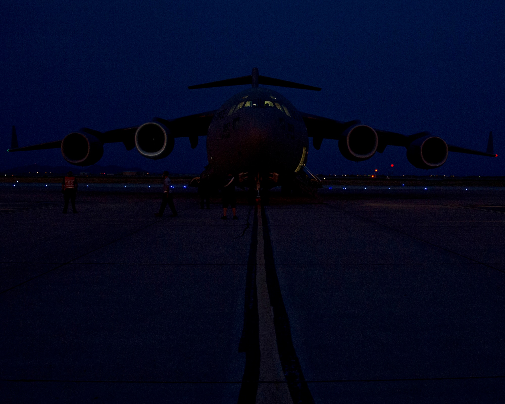 ALTUS AIR FORCE BASE, Okla. – A U.S. Air Force C-17 Globemaster III is prepped for departure for a night flight here June 28. Night flights are a key part of the 97th Air Mobility Wing’s training mission and would not be possible without the joint effort of numerous squadrons around the base. (U.S. Air Force photo by Senior Airman Kenneth W. Norman / Released)