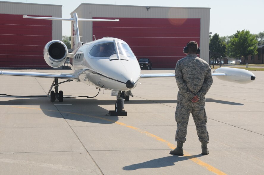 U.S. Air Force Tech. Sgt. Scott Hovda, a crew chief in the 119th Aircraft Maintenance Squadron, right, prepares to assist pilots Col. Kent Olson, the 119th Wing commander and Col. Brad Derrig, the 119th Wing vice-commander, as they launch the last C-21 aircraft number 40064 at the North Dakota Air National Guard Base, Fargo, N.D., Aug. 27, 2013. The aircraft is making its’ final flight for the unit before being retired at the National Museum of the U.S. Air Force, Dayton, Ohio, Aug. 28, 2013. This particular aircraft was the first C-21 Lear Jet built for the U.S. Air Force. The aircraft is the last to depart the unit during a mission conversion, leaving the unit without a manned flying mission for the first time since it began in 1947. It will be the only state in the United States without a manned flying mission. The unit has an outstanding flying record with over 174,000 hours without a class A mishap in manned aircraft. The 119th Wing is one of only two Air National Guard units to be selected for the U.S. Air Force Hughes Trophy, awarded to flying units, and the only Air National Guard unit to win the award twice. The unit also won the William Tell World-Wide fighter competition three times while flying fighters. (U.S. Air National Guard photo by SMSgt. David H. Lipp/Released)