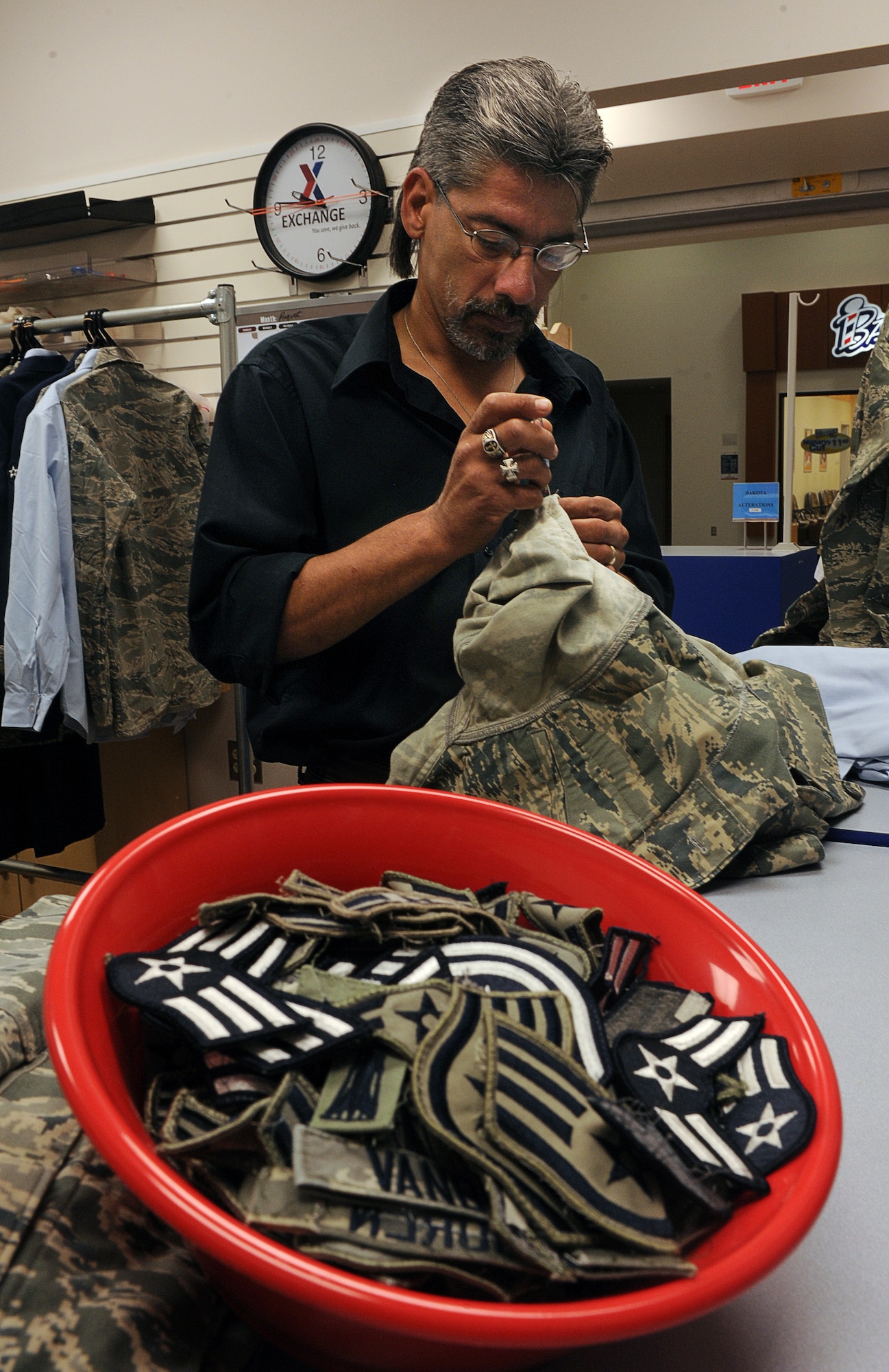 Air Force members must always adhere to standards of neatness, cleanliness, safety, uniformity and military image in regards to the wear and upkeep of their uniforms. Whether an Airman gets promoted or changes his or her name, it is important to ensure that all changes made to the uniforms are within the standards outlined in AFI 36-2903. (U.S. Air Force photos/Senior Airman Stephanie R. Sauberan)