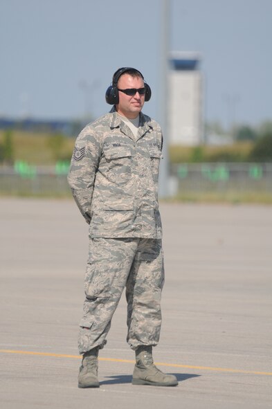 U.S. Air Force Tech. Sgt. Scott Hovda, a crew chief in the 119th Aircraft Maintenance Squadron, prepares to assist with the launch of the last C-21 aircraft number 40064 at the North Dakota Air National Guard Base, Fargo, N.D., Aug. 27, 2013. The aircraft is making its’ final flight for the unit before being retired at the National Museum of the U.S. Air Force, Dayton, Ohio, Aug. 28, 2013. This particular aircraft was the first C-21 Lear Jet built for the U.S. Air Force. The aircraft is the last to depart the unit during a mission conversion, leaving the unit without a manned flying mission for the first time since it began in 1947. It will be the only state in the United States without a manned flying mission. The unit has an outstanding flying record with over 175,000 hours without a class A mishap in manned aircraft. The 119th Wing is one of only two Air National Guard units to be selected for the U.S. Air Force Hughes Trophy, awarded to flying units, and the only Air National Guard unit to win the award twice. The unit also won the William Tell World-Wide fighter competition three times while flying fighters. (U.S. Air National Guard photo by SMSgt. David H. Lipp/Released)